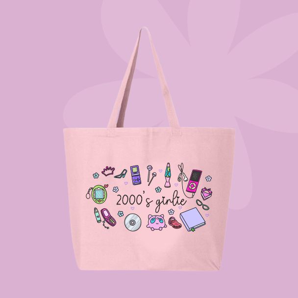Large pink canvas tote bag featuring the words 2000’s girlie surrounded by Y2K icons including a flip phone, lip gloss, CD, butterfly clip, sneakers, mp3 player, and cute doodles.