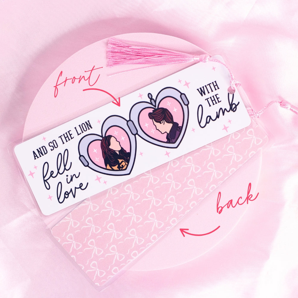 “Twilight-inspired bookmark with pink heart locket illustrations of Edward and Bella – romantic and nostalgic for vampire lovers.”