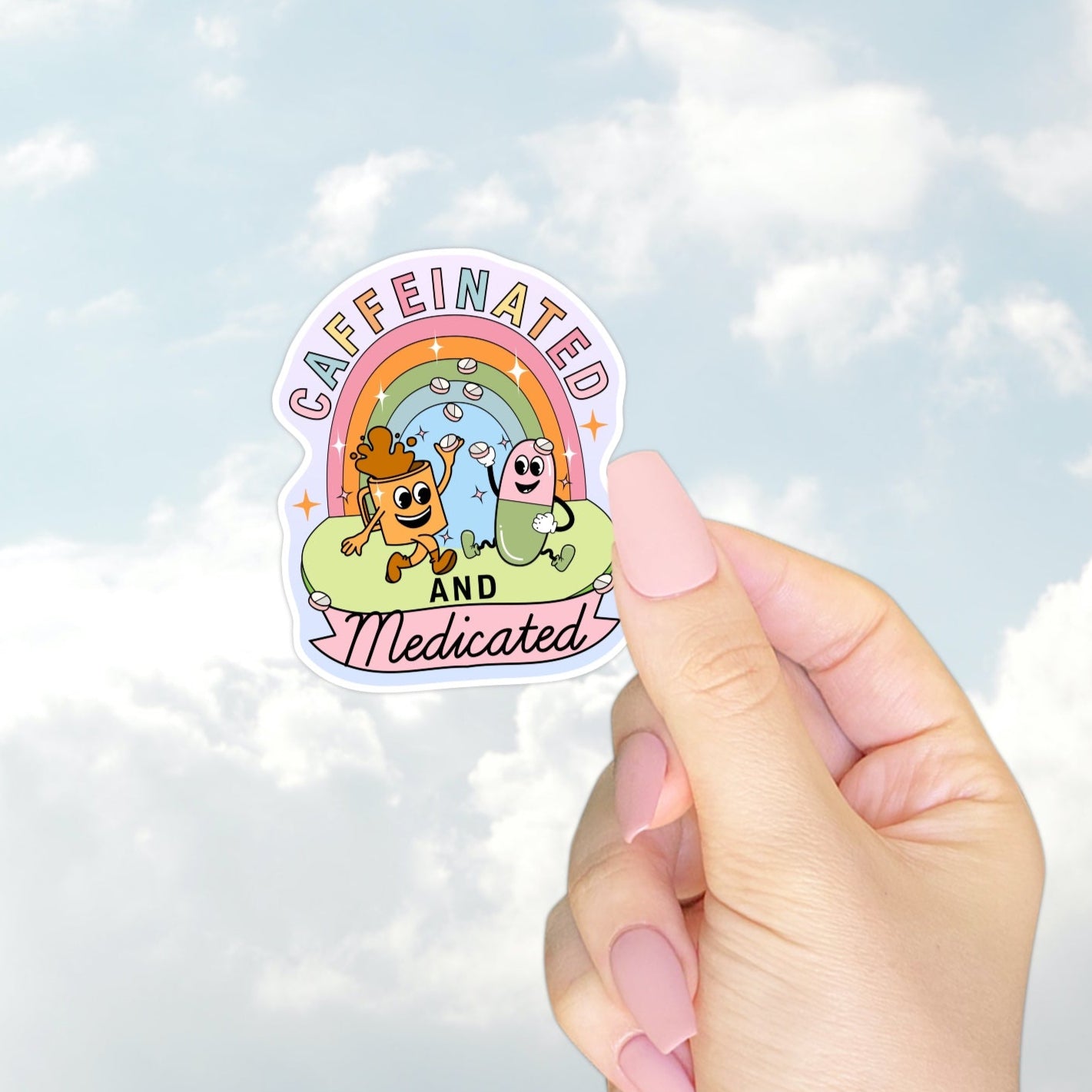 Fun rainbow sticker showing a happy coffee cup and pill dancing under a pastel rainbow with “Caffeinated and Medicated” text.