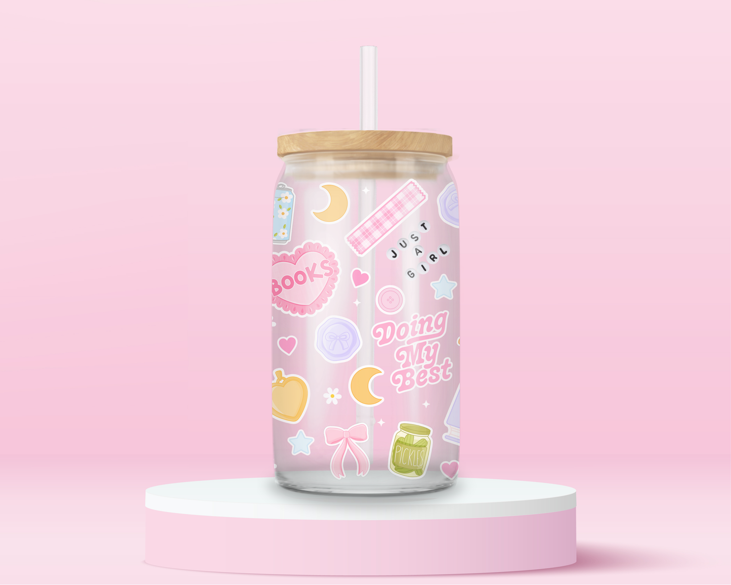 Pink girly glass can tumbler with books, croissants, bows, hearts, stars, and just a girl themed icons.