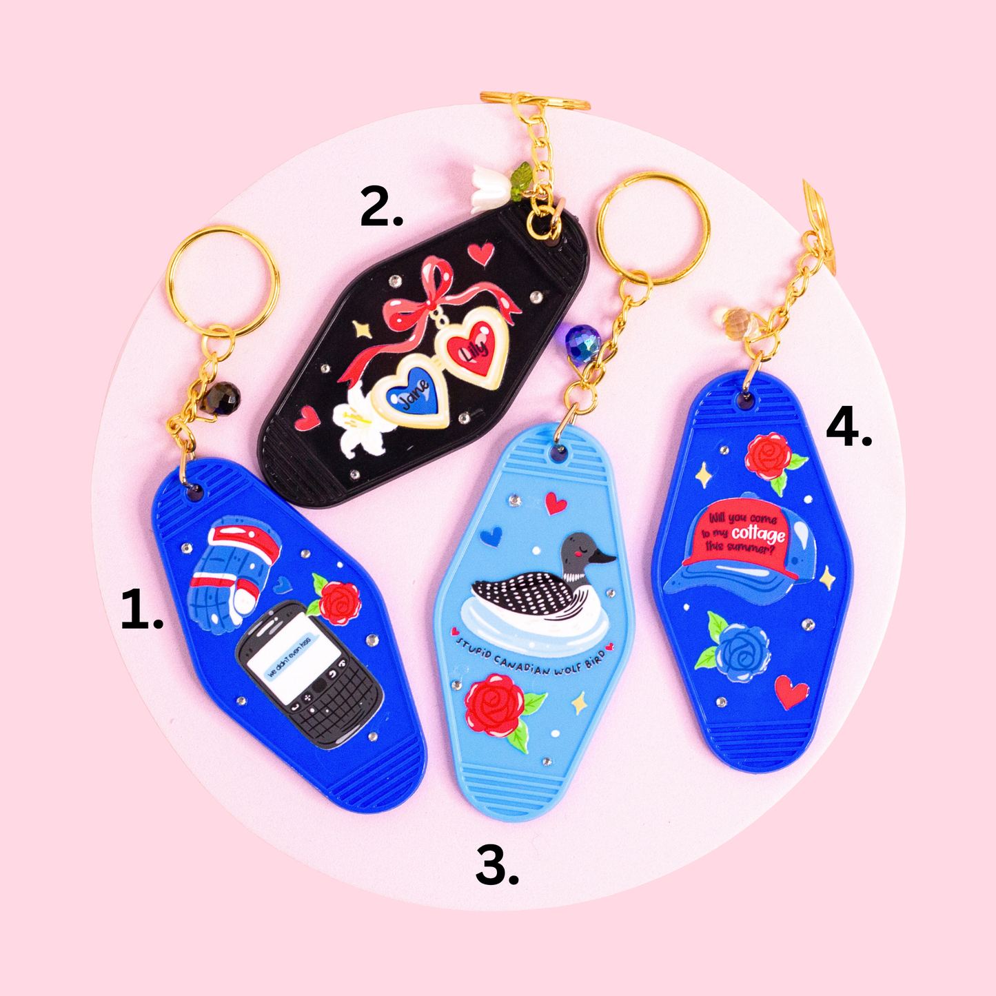 four retro motel style keychains inspired by hockey romance book, featuring blue, black and light blue designs with hearts, flowers, duck illustration and text details