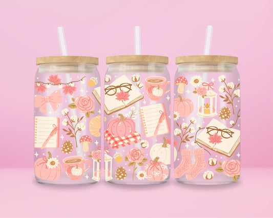 glass tumbler decorated with pumpkins, bows, notebooks, coffee, and florals with bamboo lid and straw.