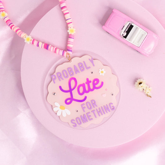 “Pastel car charm with daisy accents and ‘Probably Late for Something’ quote – relatable and aesthetic.”