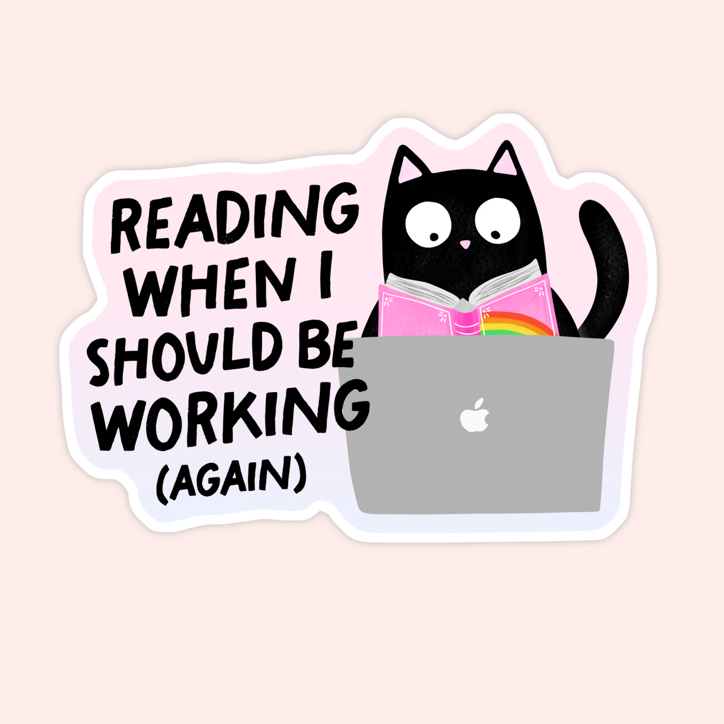 Black cat reading a pink book behind a laptop with text that reads “Reading when I should be working (again).”