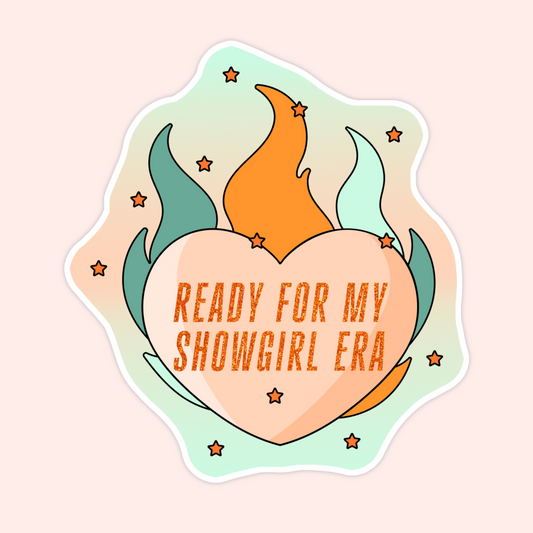 Sticker of a heart with colorful flames and the words “Ready for My Showgirl Era.”