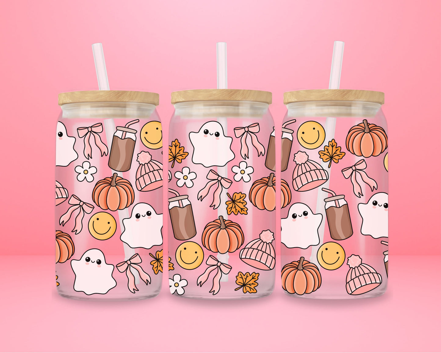 glass tumbler with ghosts, pumpkins, bows, smiley faces, coffee cups, and cozy fall details.