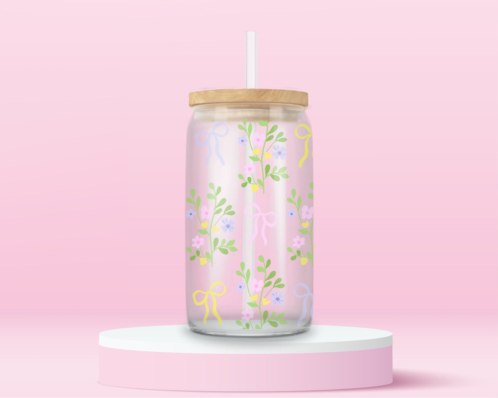 A pink glass cup with pastel-colored bows and dainty floral vines. Light, fresh, and blooming with springtime charm.