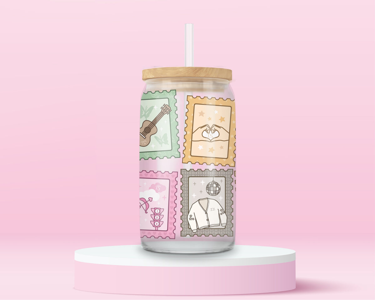 16oz Taylor Swift inspired glass tumbler with colourful illustrated postage stamps representing different eras