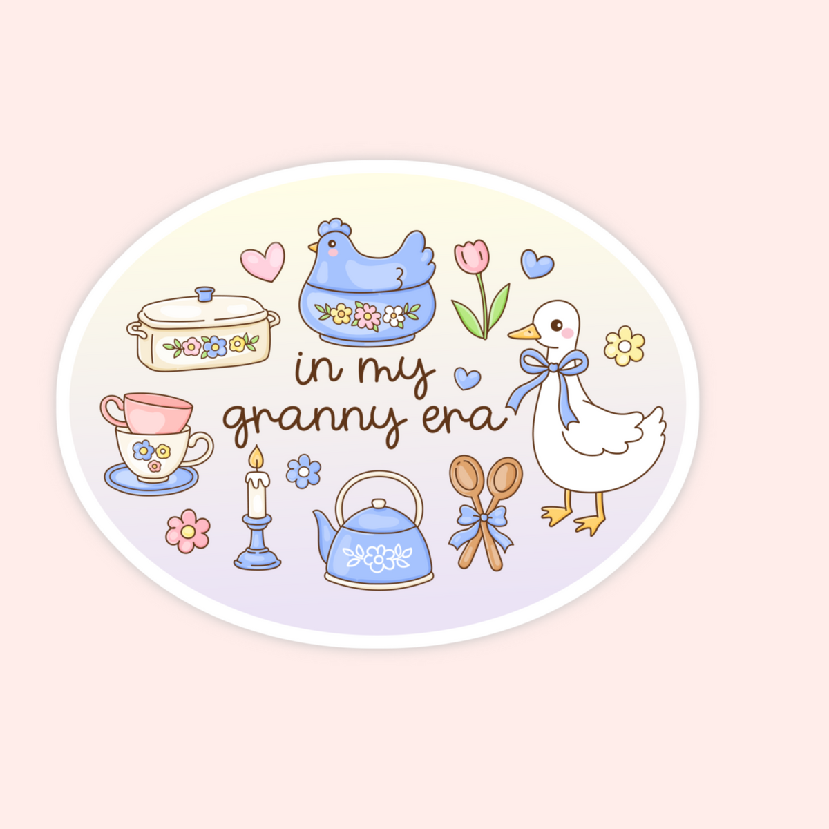 An oval sticker or decal featuring a pastel illustration of vintage kitchen items and the phrase 'in my granny era' on a pale pink background.