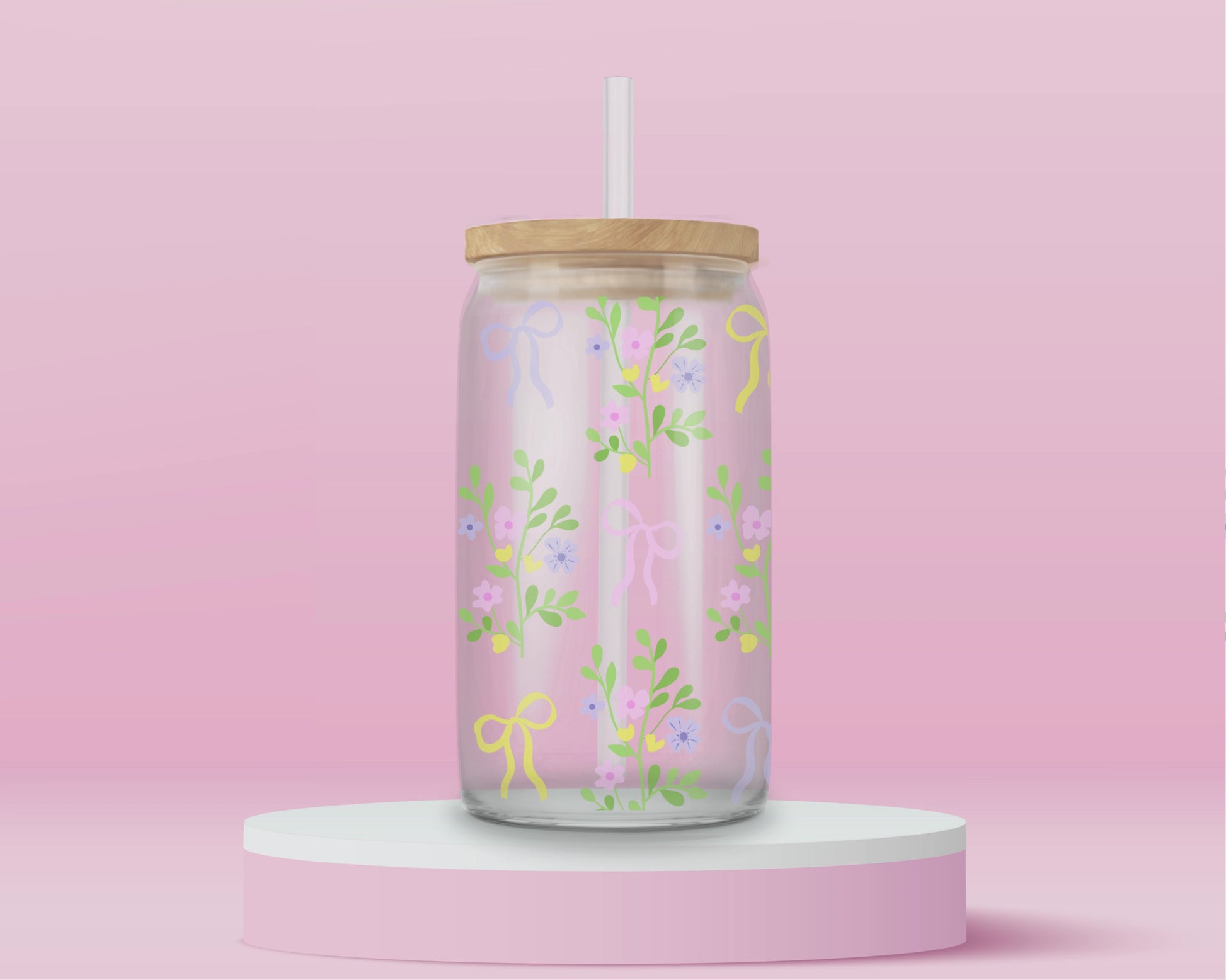A pink glass cup with pastel-colored bows and dainty floral vines. Light, fresh, and blooming with springtime charm.