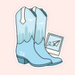 A die-cut sticker featuring a pair of light blue cowboy boots with a city skyline printed on the shafts, white pull tabs, and the initials 'T.S.
