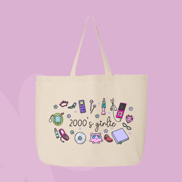 Large beige canvas tote bag featuring the words 2000’s girlie surrounded by Y2K icons including a flip phone, lip gloss, CD, butterfly clip, sneakers, mp3 player, and cute doodles.