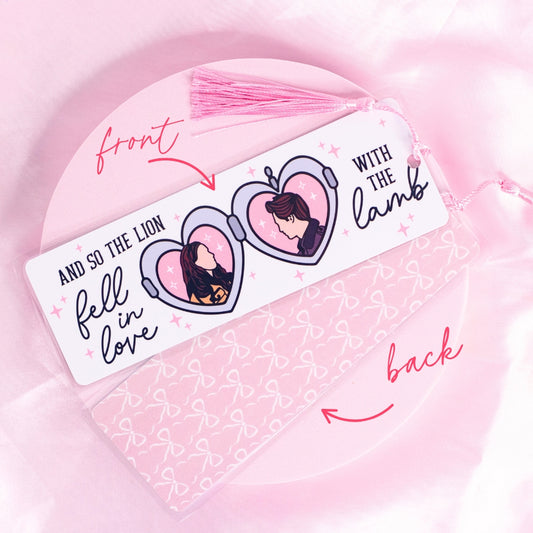 “Twilight-inspired bookmark with pink heart locket illustrations of Edward and Bella – romantic and nostalgic for vampire lovers.”