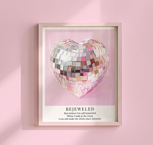 Taylor Swift Bejeweled inspired art print featuring a silver disco ball heart on a soft pink background with a girly aesthetic