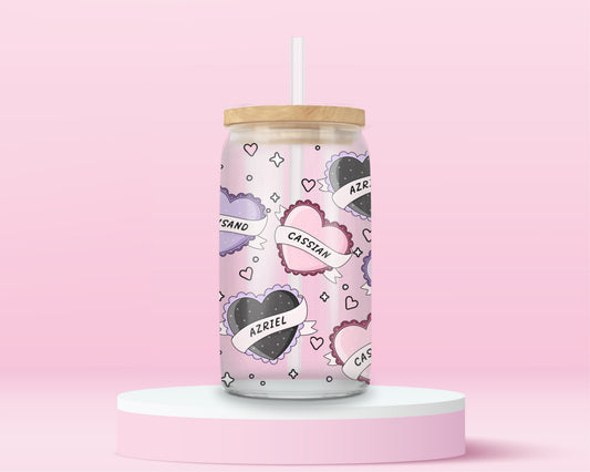 Glass tumbler with heart candies featuring the names Rhysand, Cassian, and Azriel in a fantasy romance design.