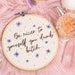 Be nicer to yourself you dumb bitch hand embroidered quote hoop with purple flowers on pink background