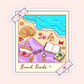 Cute beach reads sticker with a beach photo frame, open book, sunglasses, beach bag, iced drink, sunscreen, seashells, and ocean view.