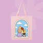 Pink canvas tote bag featuring two girls sitting together in an arched window with clouds and a blue sky.