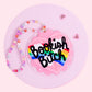 rainbow book lover acrylic car charm with pink scalloped background and colorful beaded hanger
