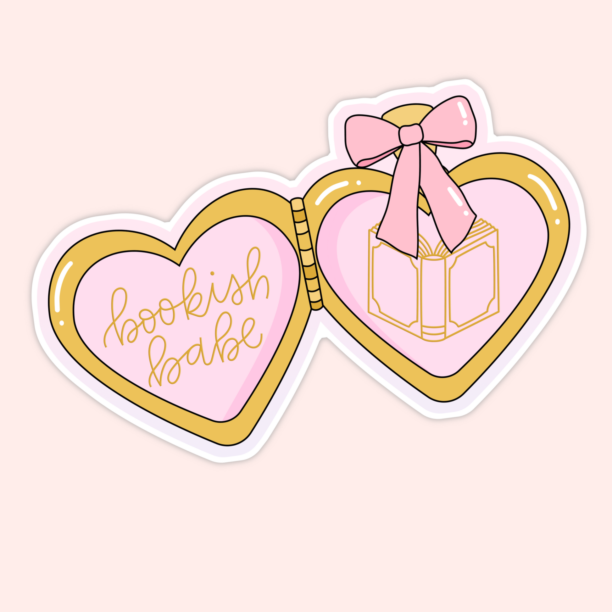 Heart-shaped pink and gold locket with a bow and an open book illustration and the phrase “bookish babe.”