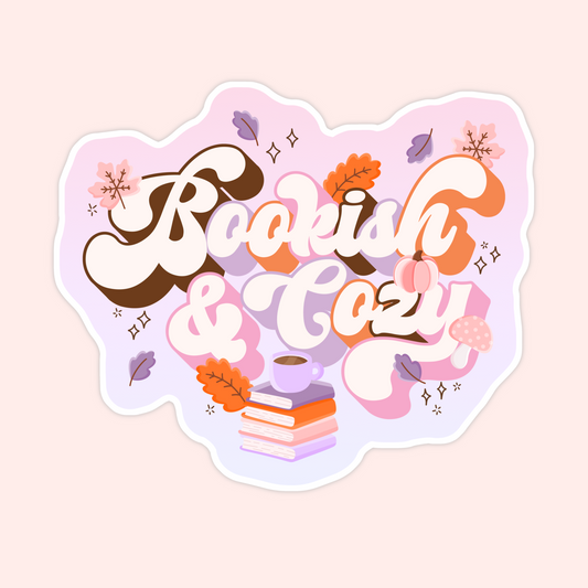 Pastel sticker with the words “Bookish & Cozy” surrounded by autumn leaves, books, coffee, and a pumpkin.