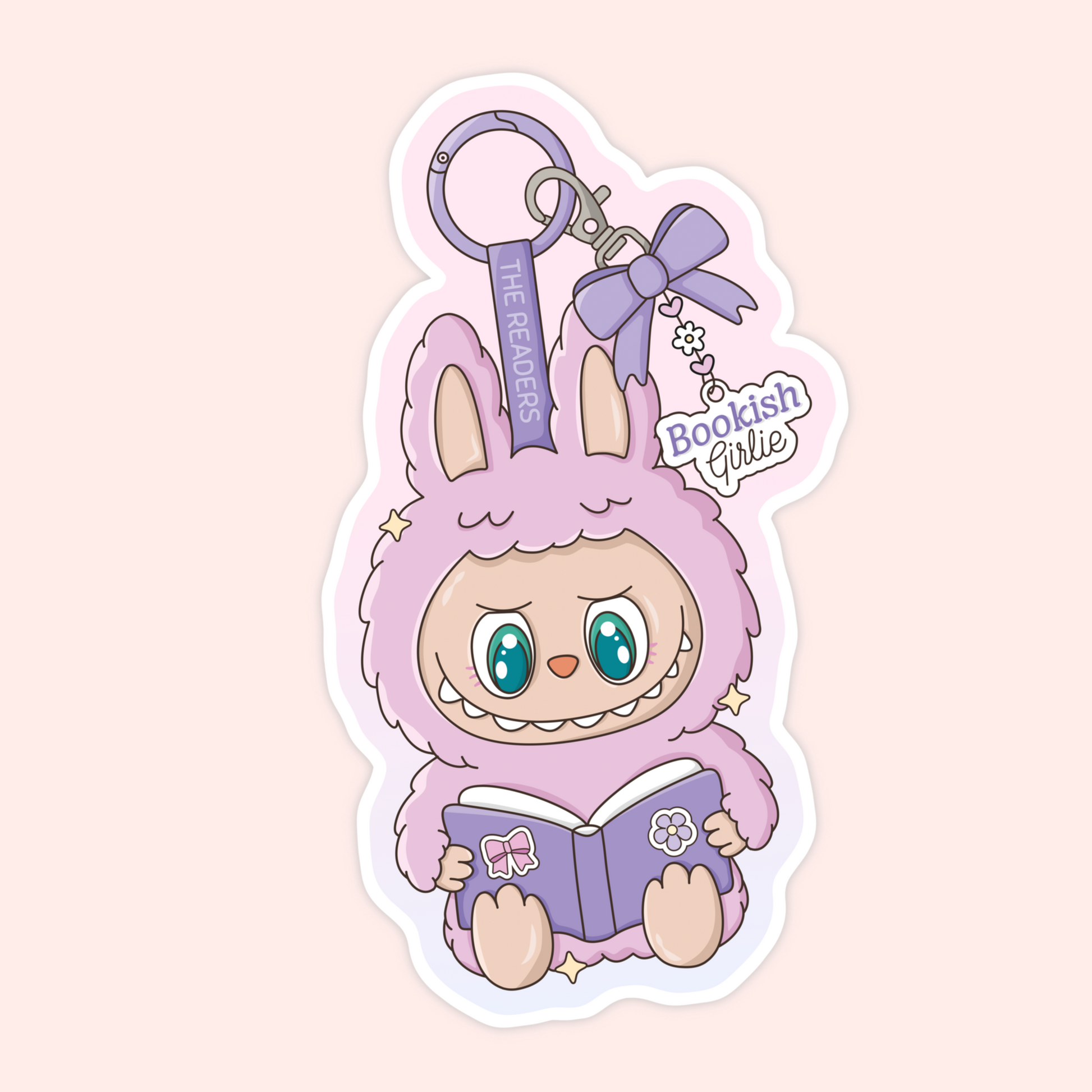 Cute purple Labubu monster holding a book with a bow keychain that says “The Readers” and “Bookish Girlie.”