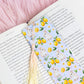 cute bunny lemon bookmark with rabbits and lemons placed inside an open book