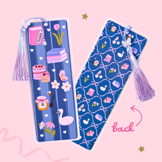 blue reader bookmark with books cake flowers and swan design with patterned back and tassel