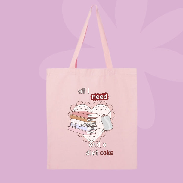 Canvas tote bag with book stack graphic and phrase all I need is books and a diet coke.