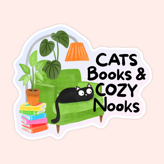 Sticker with a black cat on a green chair, books stacked beside it, houseplants, and text that says “Cats Books & Cozy Nooks.”