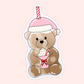 Cute illustrated vinyl sticker of a teddy bear wearing a pink winter hat and holding a festive drink with whipped cream and a candy cane.
