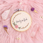 close up of dainty as fuck embroidered quote with floral embroidery in wooden hoop