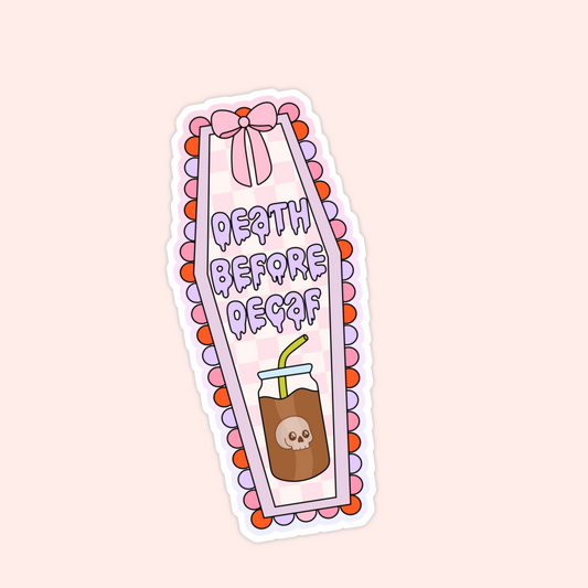 Pink and purple coffin-shaped sticker with iced coffee illustration and the phrase “Death Before Decaf.”