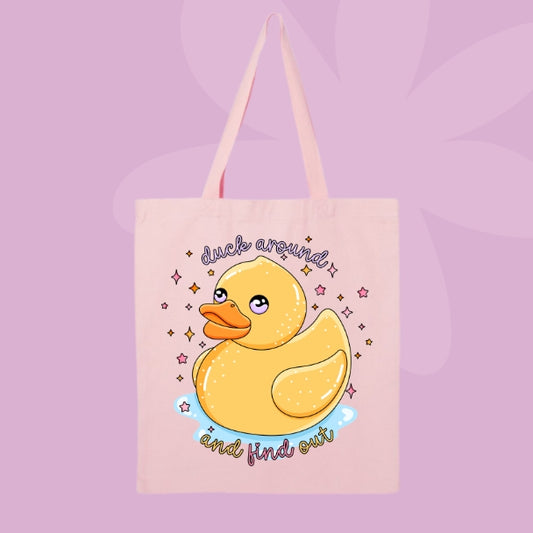 Pink canvas tote bag featuring a cute yellow rubber duck with sparkles and text that says duck around and find out.