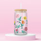 Glass tumbler with colorful wildflowers inspired by the floral design on Taylor Swift's Eras Tour piano.