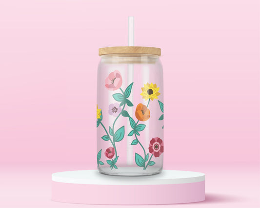Glass tumbler with colorful wildflowers inspired by the floral design on Taylor Swift's Eras Tour piano.