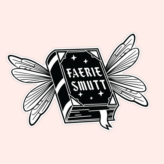 Black and white sticker of a book with fairy wings and the words “Faerie Smutt” on the cover.