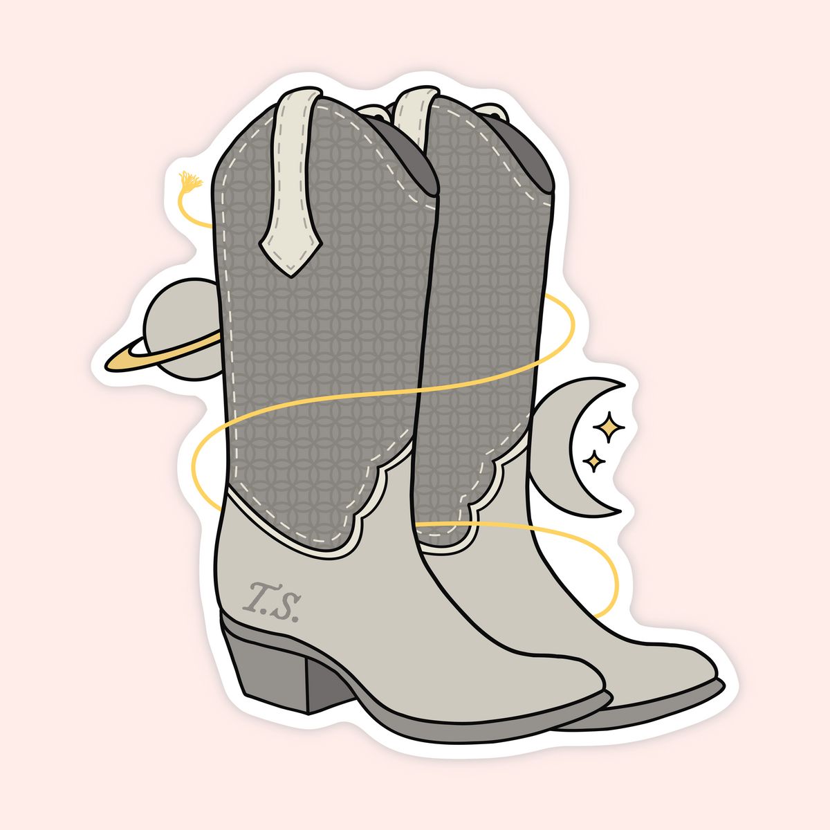 A die-cut sticker featuring a stylized pair of gray cowboy boots with celestial and space-themed doodles, including a crescent moon, stars, and a ringed planet, on a pale pink background.