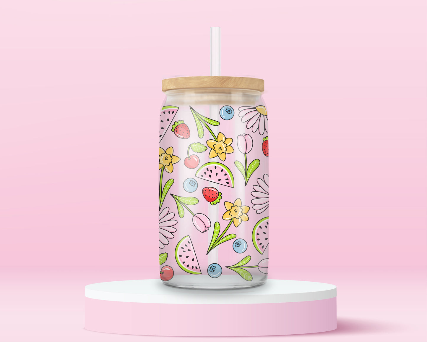 Glass cup with pink background covered in colorful fruits (watermelon, strawberries, blueberries, cherries) and spring flowers (daisies, tulips, daffodils).
