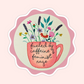 Sticker of original embroidery art featuring a pink coffee cup filled with flowers and the words Fueled By Caffeine & Feminist Rage.
