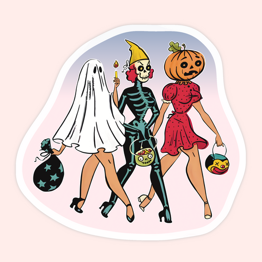 A die-cut sticker featuring a retro-style illustration of three women in Halloween costumes: a ghost in a white sheet, a skeleton in a black bodysuit with a yellow hat, and a woman in a red dress with a pumpkin head. The sticker is shown on a pale pink background.