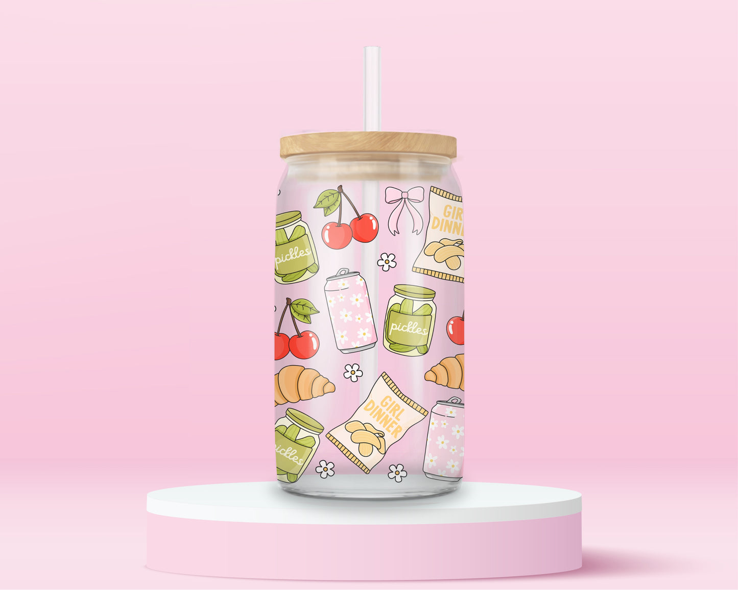 glass tumbler with jars of pickles, cherries, croissants, bows, and “Girl Dinner” snack bags, with bamboo lid and straw.