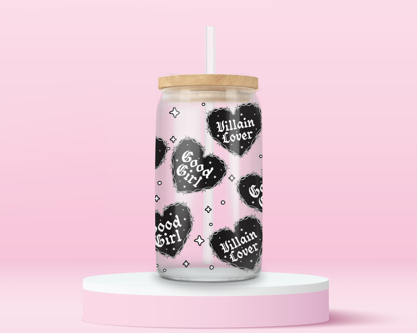 Glass can tumbler with bamboo lid and glass straw featuring black gothic heart designs with the words Good Girl and Villain Lover on a pink background.