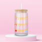 Glass tumbler with charm chains spelling good luck babe with colorful lucky symbols.