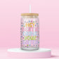 Glass tumbler with colorful text that reads hey bestie drink your water surrounded by flowers.
