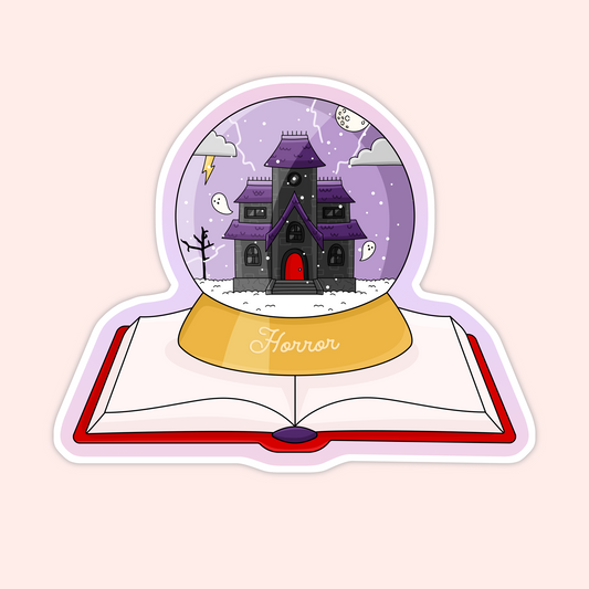 A spooky-cute vinyl sticker featuring a horror-themed snow globe resting on an open book. Perfect for horror readers and dark bookish aesthetics.