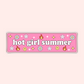 A hand holding a pink bumper sticker that says "hot girl summer" surrounded by daisies, flames, smiley faces, and sparkles.
