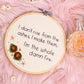 Hand embroidered feminist quote hoop reading I’m the whole damn fire styled on pink faux fur with crystals and perfume bottle