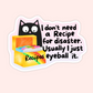 Black cat beside rainbow recipe box with text that reads “I don’t need a recipe for disaster. Usually I just eyeball it.”