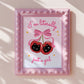 Pair of shiny red cherries with black kitten faces and a big pink bow, with the phrase “I’m literally just a girl.”